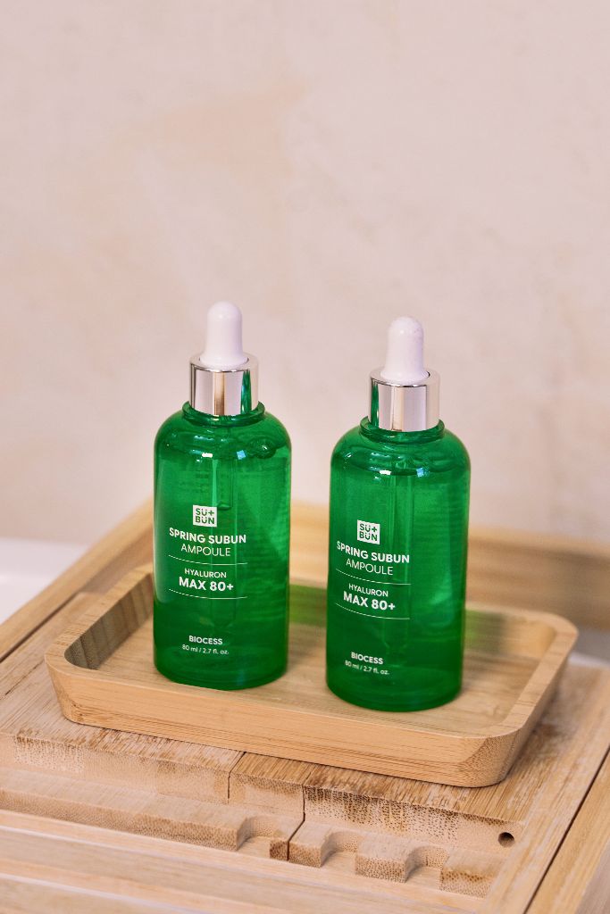 Two bottles on bamboo tray
